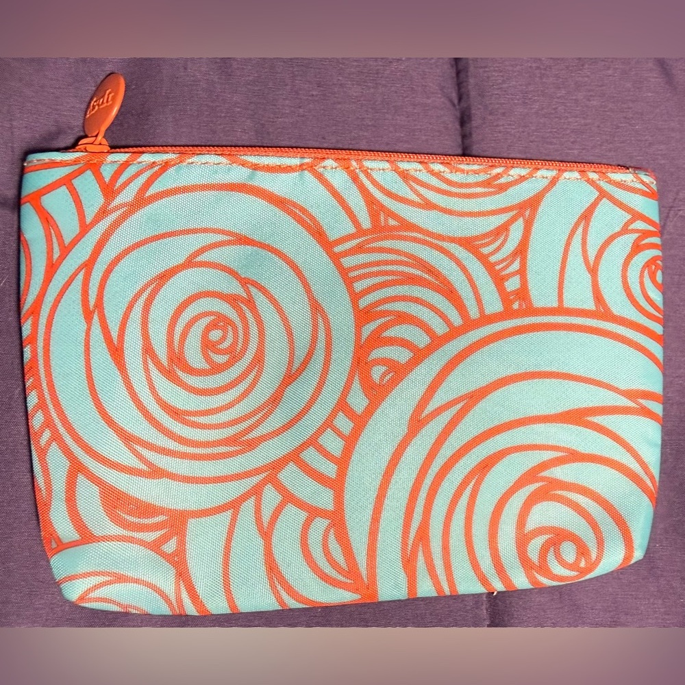 Ipsy Orange and teal patterned cosmetic/small essentials Bag